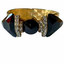 Load image into Gallery viewer, Vintage 1980’s Black Faux Onyx Gold Tone Rhinestone Bow Wide Hinged Bracelet
