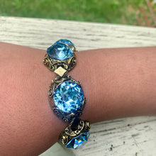 Load image into Gallery viewer, Vintage Brass Tone Filigree Faux London Blue Topaz Sparkling Large Cabochons Bracelet
