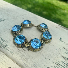 Load image into Gallery viewer, Vintage Brass Tone Filigree Faux London Blue Topaz Sparkling Large Cabochons Bracelet
