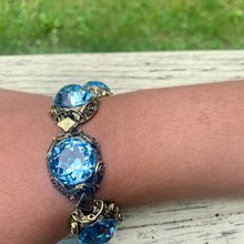 Load image into Gallery viewer, Vintage Brass Tone Filigree Faux London Blue Topaz Sparkling Large Cabochons Bracelet
